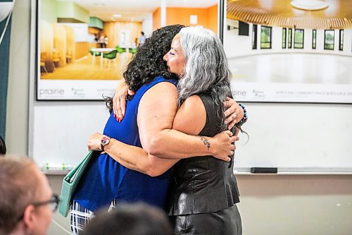 MIKAELA MACKENZIE / FREE PRESS
	
Families Minister Nahanni Fontaine (right) embraces Cynthia Drebot, executive director of the North End Womenճ Centre, after announcing new funding for the centre on Monday, July 27, 2026. 

For Malak story.
Free Press 2026