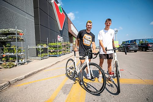MIKAELA MACKENZIE / FREE PRESS
Val Duquenne (left) and Thomas Clark with their new bikes on Monday, July 27, 2026. The two are biking across Canada to raise awareness for menճ mental health, and have just gotten new bikes through community support after having their original ones stolen during their stop in Winnipeg.
For Tiago story.
Free Press 2026