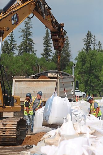 With the flood waters along the Assiniboine River receding and the City of Brandon shifting from flood response to recovery and clean up, work crews began removing the super sandbags on Monday that lined the northbound lanes of First Street North. (Matt Goerzen/The Brandon Sun)