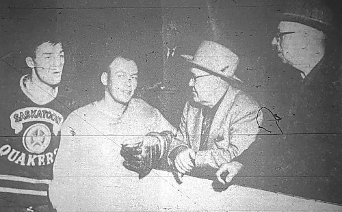 Bob Chrystal and Norm Johnson talk to veteran hockey fans W. D. (Bill) Creighton and E. Stanley Martin at Brandon regals training camp at Wheat City Arena in a picture that appeared in The Brandon Sun on Sept. 28, 1956. (Brandon Sun files)