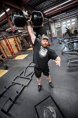 JOHN WOODS / FREE PRESS
Tyler Sigurdson, owner of Iron Age Strength and Conditioning gym, trains for the Strongman competition at the Gimli Icelandic Festival by lifting a circus dumbbell in the downtown Winnipeg gym Tuesday, June 30, 2026. 

reporter: eva