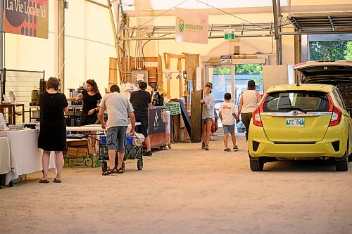 Mike Sudoma / Free Press
Vendors grab equipment and product out of their cars Saturday morning as they get ready to set up their booths inside of the St Norbert Farmers Market and prepare for a busy day ahead
July 25, 2026