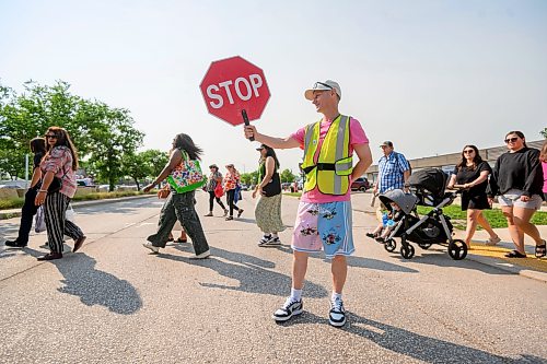 Mike Sudoma / Free Press
Crossing Guard Adam Affleck helps with the flow of both pedestrian and vehicular traffic control during the St Norbert Farmers Market peak business hours between 10:30am and 1:30pm Saturday afternoon
July 25, 2026