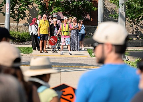 Mike Sudoma / Free Press
Crossing Guard Adam Affleck helps with pedestrian and traffic control during the St Norbert Farmers Market peak business hours between 10:30am and 1:30pm Saturday afternoon Since the market is located on a busy trucking route to the US border Afflecks job is quite integral to the safety of the event while keeping an optimal flow of traffic.
July 25, 2026
