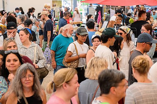Mike Sudoma / Free Press
Shoppers are shoulder to shoulder visiting different vendors inside of the shelter at the St Norbert Farmers Market around 12pm Saturday afternoon
July 25, 2026
