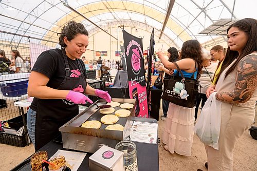 Mike Sudoma / Free Press
Los Comales Morales co-owner Helena Morales cooks up an order of quesadillas inside the St Norbert Farmers Market Saturday morning
July 25, 2026