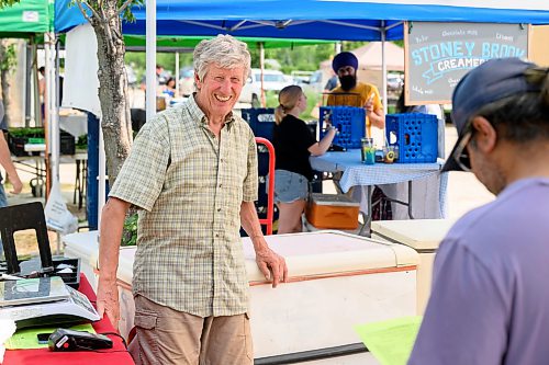 Mike Sudoma / Free Press
Jim Lintott of Lintott Farms smiles as he helps a customer at his booth at the St Norbert Farmers Market Saturday afternoon
July 25, 2026
