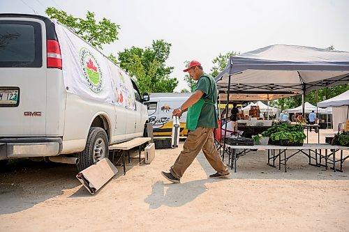 Mike Sudoma / Free Press
Tom Wang of Fertile Farms folds up a few tables as he gets ready to leave a bit early as he was almost fully sold out by 130pm Saturday afternoon
July 25, 2026