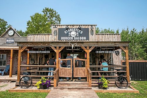 BROOK JONES/FREE PRESS
The Starlette's Burger Saloon at 60122 Juno Rd., just north of Elma, Man., is pictured on Saturday, July 25, 2026. Star Giesbrecht and her husband Lee Giesbrecht opened the Starlette's Burger Saloon in May 2025 after Lee made the dining patio to like an old-fashioned, western saloon from recovered barn wood.