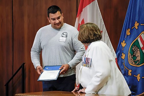 JOHN WOODS / FREE PRESS
Rescue award recipient Preston Waide Houle is presented with a lifesaving award from the lieutenant governor Anita Neville at the Lifesaving Society Manitoban Awards in Government House Tuesday, July 28, 2026.
reporter: morgan