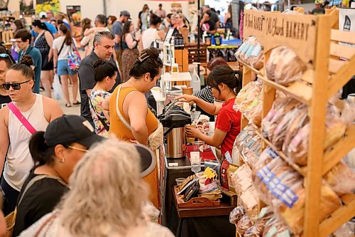 Mike Sudoma / Free Press
By 11am the market is bustling at peak business. Shoppers are shoulder to shoulder visiting different vendors inside of the shelter at the St Norbert Farmers Market Saturday morning
July 25, 2026