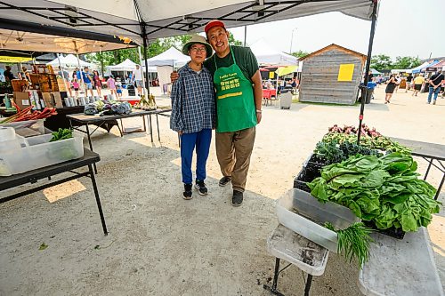 Mike Sudoma / Free Press
Ming Zhai and Tom Wang of Fertile Farms hangout under their booths canopy after a busy day and almost fully selling out of their inventory by 130pm
July 25, 2026