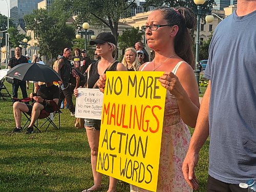 About 200 people gathered at the Manitoba legislature Wednesday evening for a “No More Manitoba Maulings” rally. (Morgan Modjeski / Free Press)