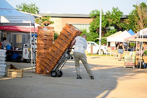 Mike Sudoma / Free Press
Vendors set up their booths at the St Norbert Farmers Market early Saturday morning
July 25, 2026