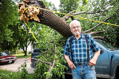 MIKAELA MACKENZIE / FREE PRESS
Jake Falk shows a tree that fell on his truck during the storm on Stewart Street on Thursday, July 30, 2026.
For Chris story.
Free Press 2026