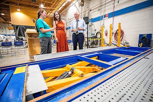 MIKAELA MACKENZIE / FREE PRESS
Cassandra Foy, final year collision, repair and refinishing program student (left), Rene Cable, minister of advanced education, and Lloyd Schreyer, RRC Polytech board chair, check out the car-o-liner that MPI donated to RRC Polytechճ collision repair and refinishing program on Thursday, July 30, 2026.
For Gabby story.
Free Press 2026