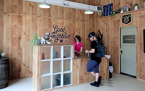 Ruth Bonneville  Free Press

ENT - Good Neighbour

Kayla Goossen helps out a customer at the counter at the new location in South Osborne. 

Photo of the new south Osborne location of Good Neighbour Brewing, which will eventually include a brewery. For now, the site features a retail fridge stocked with its craft beer and an outdoor seating area.

Story by Ben Sigurdson 

May 21st, 2026
