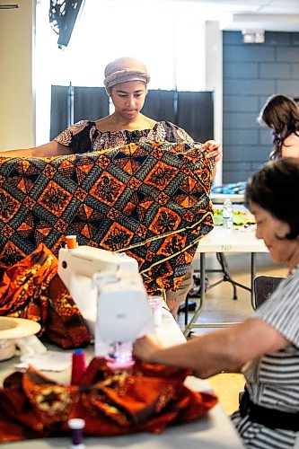 MIKAELA MACKENZIE / FREE PRESS
	
Jubilee Wormenor, dancer at the pavilion, looks through fabric while working to replace cultural costumes (after the outfits were stolen from a parked vehicle) at the Notre Dame Recreational Centre on Friday, July 31, 2026.

For Chris story.
Free Press 2026