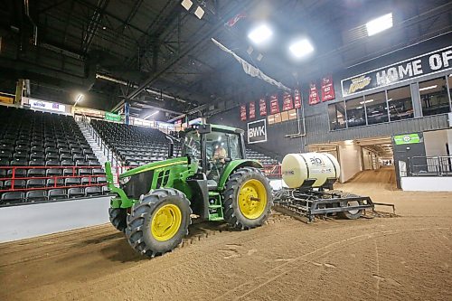 Footing technician Allan Quast with Canada’s National Arabian Championship, operates a tractor in the main arena of the Keystone Centre to level the ground for the horses, in advance of the show’s start next week Thursday here in Brandon. (Matt Goerzen/The Brandon Sun)