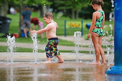 Hudson Bryson, 2, from Ontario plays with the water fountains at the Rideau Park Splash Pad on a pleasantly warm Friday afternoon. (Matt Goerzen/The Brandon Sun)