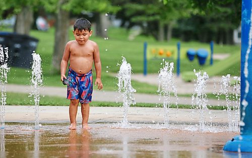 A young boy stands on one of the water fountains at the Rideau Park Splash Pad on a pleasantly warm Friday afternoon. (Matt Goerzen/The Brandon Sun)