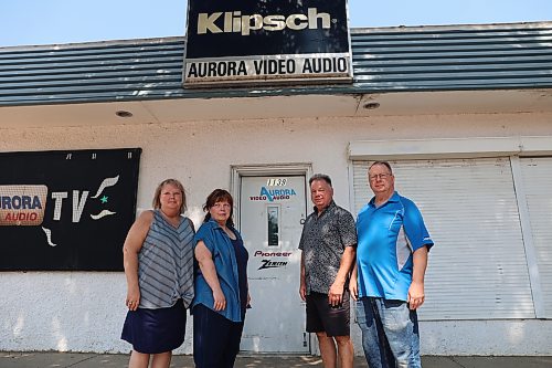 Aurora Video Audio general manager Walter Kosior (left), finance officer Lisa Kosior (second left), vice president Charlene Thompson, and president Jacob Kosior stand in front of the store on Saturday afternoon. Aurora Video Audio is permanently closing its doors, ending an era for local electronics repair after six decades of repairing televisions and serving generations of customers in Brandon and Westman. (Abiola Odutola/The Brandon Sun)