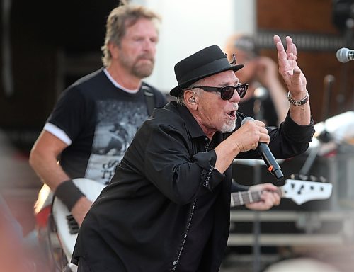 Harlequin lead singer George Belanger gestures in front of bassist Chris Burke-Gaffney during Rockin’ the Fields of Minnedosa on Sunday. (Perry Bergson/The Brandon Sun)