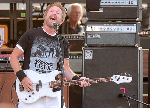 Chris Burke-Gaffney of Orphan and The Pumps, who also plays bass with Harlequin, sings Orphan's hit "Miracle" during Harlequin's set at Rockin’ the Fields of Minnedosa on Sunday. (Perry Bergson/The Brandon Sun)