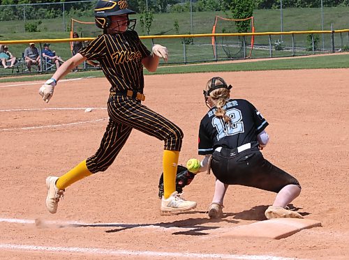 Westman Magic base runner Tenley Figol arrives safely at first base as Saskatoon Raiders first baseman Devyn Rieger (12) has a one-hop throw to her bag bounce off her glove during the under-13 final against the Saskatoon Raiders at the Wheat City Classic at the Ashley Neufeld Softball Complex on June 14. The Magic and Raiders will meet again on Friday at the U13 western Canadian championship. (Perry Bergson/The Brandon Sun)
June 14, 2026