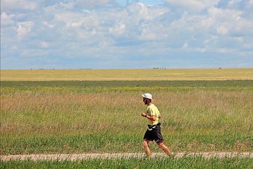 04082026
James Newman runs along a service road beside the Trans Canada Highway west of Brandon on Tuesday as part of his goal to run across Canada in under 100 days. Newman is using his James Runs Canada run to raise money to support scholarships for youth through the Children’s Aid Foundation of Canada’s Post-Secondary Education Program.
(Tim Smith/The Brandon Sun)
