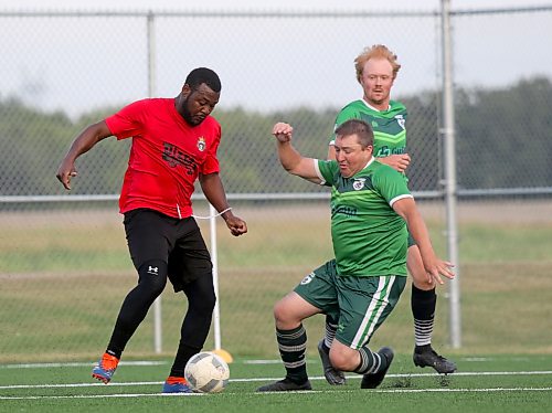 Brandon Inspire FC striker Kale Wilson shakes off a Minnedosa Triumph defender during their Westman Royal Super League soccer game at Cougars Field on Wednesday. (Thomas Friesen/The Brandon Sun)