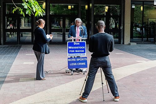 MIKE DEAL / FREE PRESS
Mayoral candidate Don Woodstock unveils his plan to overhaul how City Council and it’s committees work during a press conference Wednesday morning in the courtyard at City Hall, 510 Main Street.
260805 - Wednesday, August 05, 2026.