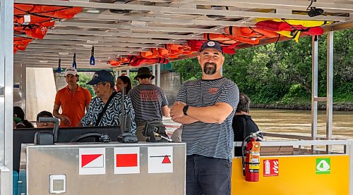 ROBERT LEE / FREE PRESS
Will Belford, co-owner of Winnipeg Waterways, poses with the new boat used for water bus service stationed at The Forks on Wednesday, August 5, 2026.