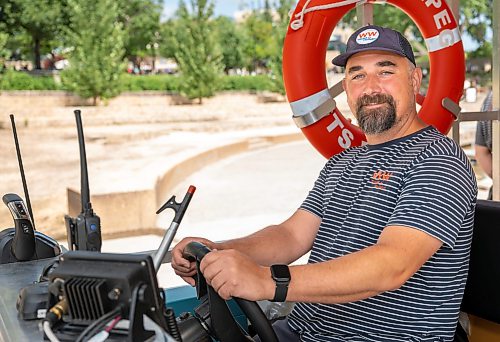 ROBERT LEE / FREE PRESS
Will Belford, co-owner of Winnipeg Waterways, poses with the new boat used for water bus service stationed at The Forks on Wednesday, August 5, 2026.