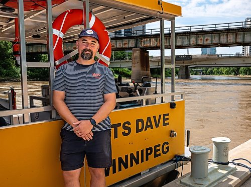 ROBERT LEE / FREE PRESS
Will Belford, co-owner of Winnipeg Waterways, poses with the new boat used for water bus service stationed at The Forks on Wednesday, August 5, 2026.