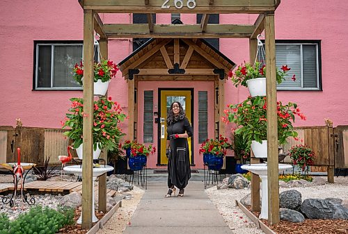 ROBERT LEE / FREE PRESS
Beryl Boney poses outside of her award-winning garden on St. Mary's Road in Winnipeg, on Thursday, August 6, 2026. Boney, who grew up in Trinidad and Tobago, has spent 25 years transforming the front and back of her block with flowers and vegetables, including ceramic chickens that nod to her Caribbean roots.