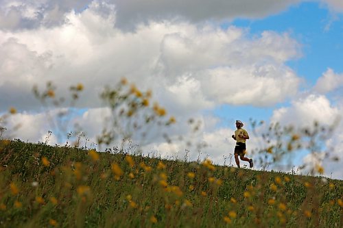 James Newman runs along the Trans-Canada Highway west of Brandon last week as part of his goal to run across Canada in under 100 days. Newman is using his run, dubbed James Runs Canada, to raise money to support scholarships for youth through the Children’s Aid Foundation of Canada’s Post-Secondary Education Program. 
(Tim Smith/The Brandon Sun)