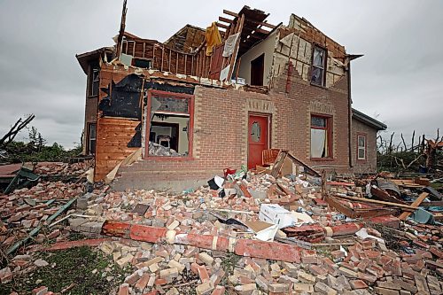 29062026
The home belonging to Brian and Bernadine Brown south of Rossburn, Manitoba on Monday after a powerful tornado hit the property on Sunday evening while Brian and Bernadine were inside. Their home, several other buildings on the property, vehicles and hundreds of trees were all heavily damaged by the tornado, but luckily escaped uninjured. 
(Tim Smith/The Brandon Sun)