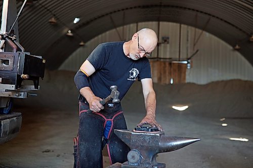 06082026
Ferrier Todd Bailey of Saskatoon works on a show package of horseshoes for Slow Ride CCF, a purebred Arabian with Wunderbar Arabians out of Saskatoon at the first day of Canada's National Arabian Championship at the Keystone Centre on Thursday. Bailey is one of the ferrier’s on hand to help shoe horses competing throughout the championship.
(Tim Smith/The Brandon Sun)