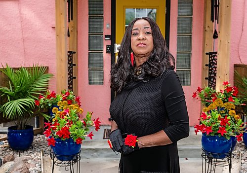 ROBERT LEE / FREE PRESS
Beryl Boney poses outside of her award-winning garden on St. Mary's Road in Winnipeg, on Thursday, August 6, 2026. Boney, who grew up in Trinidad and Tobago, has spent 25 years transforming the front and back of her block with flowers and vegetables, including ceramic chickens that nod to her Caribbean roots.
