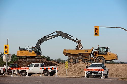 06082026
Work is done to remove the dike at 18th Street North and Grand Valley Road in Brandon on Thursday. (Tim Smith/The Brandon Sun)