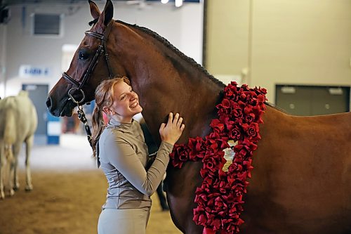 06082026
Handler Taryn Weiss with Silver Sands Performance Horses out of Allendale, Michigan celebrates with her full Arabian Aslan LRA after winning National Champion in the Arabian Sport Horse In-Hand Geldings 2 and Over Hunter Type ATH class at the first day of Canada's National Arabian Championship at the Keystone Centre on Thursday.
(Tim Smith/The Brandon Sun)