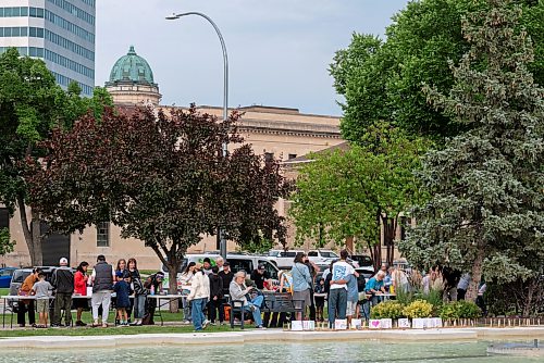 ROBERT LEE / FREE PRESS
Dozens gather at Winnipeg’s Memorial Park fountain for a Lanterns for Peace ceremony on Thursday, August 6, 2026, marking 81 years since the atomic bombings of Hiroshima and Nagasaki, which killed more than a quarter million people, mainly civilians.