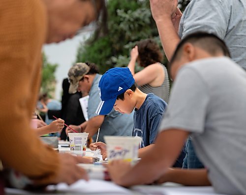 ROBERT LEE / FREE PRESS
Tatsuki, 8, decorates his lantern at Winnipeg’s Memorial Park fountain for the Lanterns for Peace ceremony on Thursday, August 6, 2026, marking 81 years since the atomic bombings of Hiroshima and Nagasaki, which killed more than a quarter million people, mainly civilians.