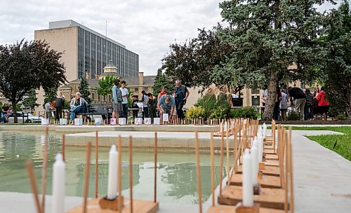 ROBERT LEE / FREE PRESS
Dozens gather at Winnipeg’s Memorial Park fountain for a Lanterns for Peace ceremony on Thursday, August 6, 2026, marking 81 years since the atomic bombings of Hiroshima and Nagasaki, which killed more than a quarter million people, mainly civilians.