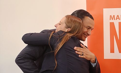Manitoba Premier Wab Kinew (right) hugs newly named Brandon West NDP candidate Cora Dupuis after Dupuis’ nomination on Thursday evening. (Alex Lambert/The Brandon Sun)