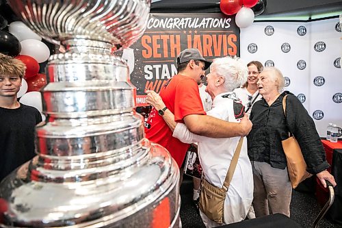 MIKAELA MACKENZIE / FREE PRESS
	
Seth Jarvis hugs his grandmother, Ruth Shields, and the Stanley Cup at the Tuxedo Community Centre on Monday, Aug. 10, 2026.

For Grace Penner story.
Free Press 2026