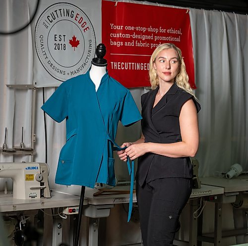 ROBERT LEE / FREE PRESS
Medical student and entrepreneur Kayla Curtis, 28, poses for a photo at The Cutting Edge in Winnipeg on Monday, August 10, 2026. Curtis is a fourth-year medical student at the University of Manitoba and founder of Mediluxe Scrubs Ltd., a women’s medical scrubs brand manufactured at The Cutting Edge, a facility run by the Canadian Women Muslim Institute, which supports refugee and newcomer women and families.