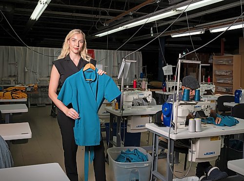 ROBERT LEE / FREE PRESS
Medical student and entrepreneur Kayla Curtis, 28, poses for a photo at The Cutting Edge in Winnipeg on Monday, August 10, 2026. Curtis is a fourth-year medical student at the University of Manitoba and founder of Mediluxe Scrubs Ltd., a women’s medical scrubs brand manufactured at The Cutting Edge, a facility run by the Canadian Women Muslim Institute, which supports refugee and newcomer women and families.
