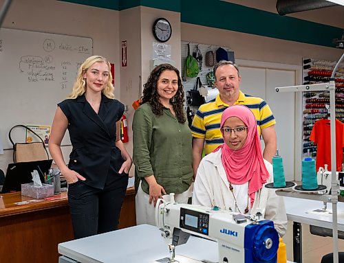 ROBERT LEE / FREE PRESS
Medical student and entrepreneur Kayla Curtis, left, Maria Rabadi, senior manager of social enterprises and employment services, Mohammad Agha, manager of The Cutting Edge, and Rozelina Dauda, sewing instructor, pose for a photo at The Cutting Edge in Winnipeg on Monday, August 10, 2026. 